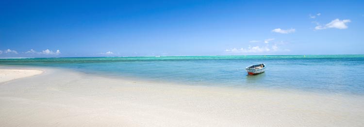 The Just2Mauritius brochure details luxury resorts beside white sand beaches